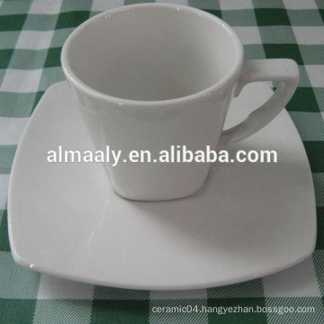 white ceramic cup and saucer with beautiful decal